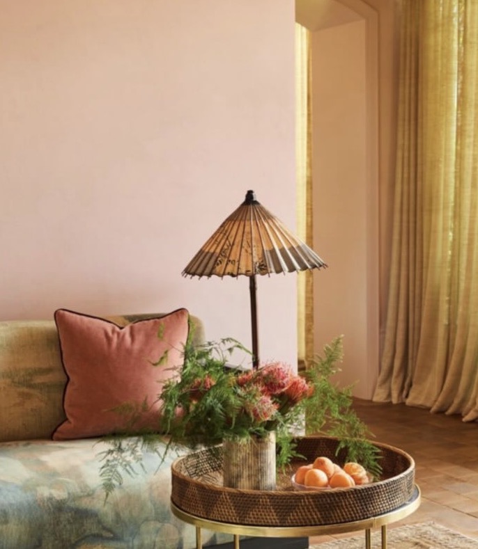 Blush sitting room with parasol lamp and brass tray table at The Spa at Hotel Chelsea