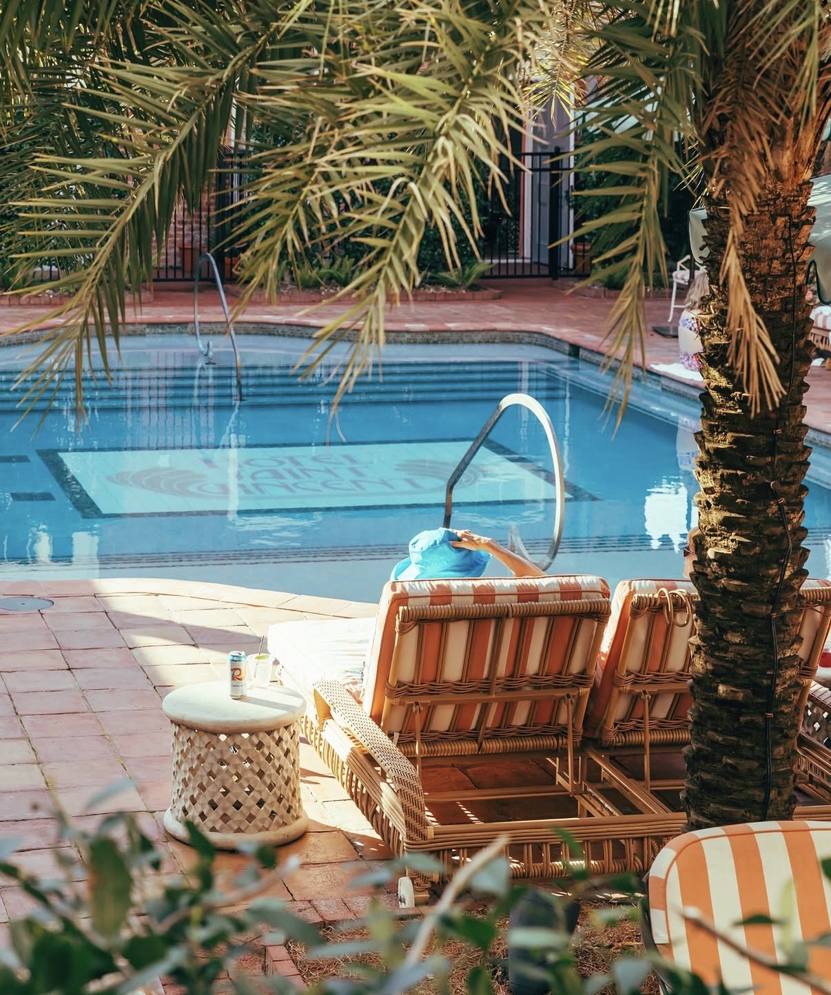 Palm-shaded pool at Hotel Saint Vincent in New Orleans